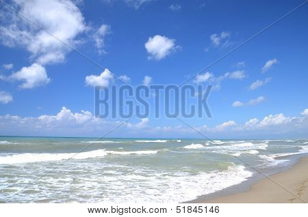 Restless sea on sandy beach Marina di Vecchiano nearby Pisa, Tuscany in Italy