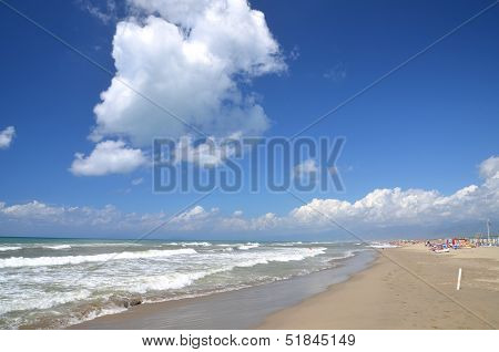 Restless sea on sandy beach Marina di Vecchiano nearby Pisa, Tuscany in Italy