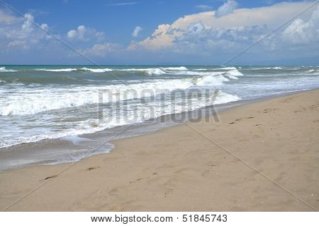 Restless sea on sandy beach Marina di Vecchiano nearby Pisa, Tuscany in Italy