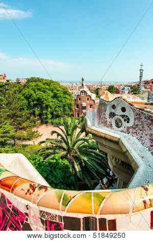 BARCELONA, SPAIN - JULY 19: Ceramic mosaic Park Guell on July 19, 2013 in Barcelona, Spain. Park Guell is the famous architectural town art designed by Antoni Gaudi and built in the years 1900 to 1914