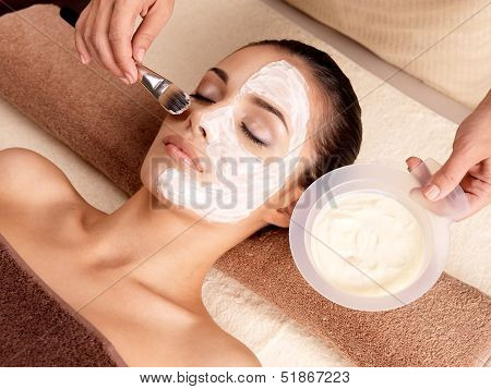 Spa Therapy For Woman Receiving Facial Mask