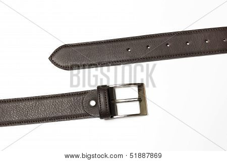 Unfastened brown leather belt