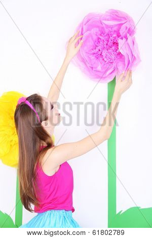 Beautiful young woman in petty skirt with big flower close up