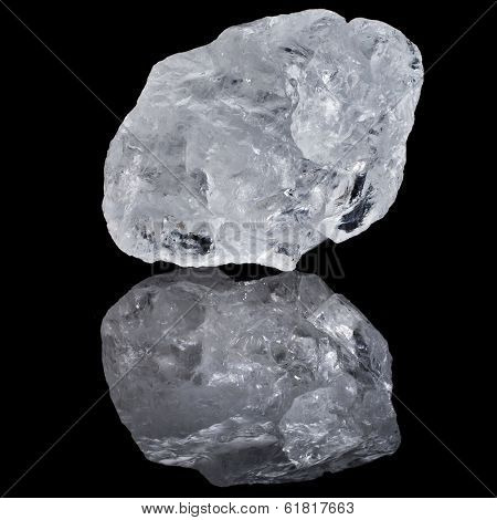 single white transparent Quartz, Rock Crystal with reflection on black surface background 