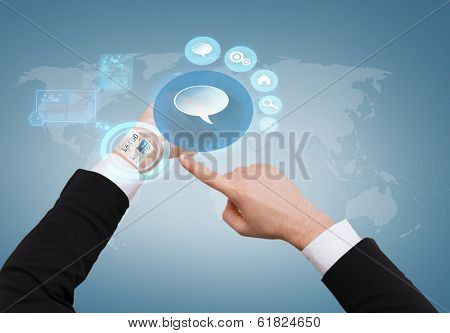 social networking, time, business and new technology concept - close up of businessman pointing to virtual watch at his hand