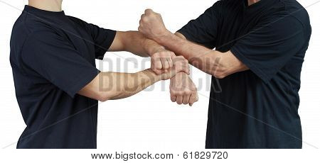 On a white background techniques of Wing Chun are performing two athletes