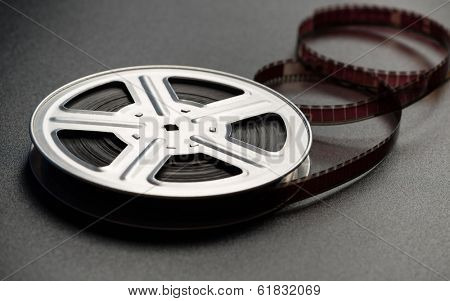 Motion picture film reel on the table