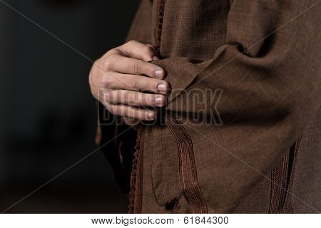 Close-up Of Male Hands Praying In Mosque