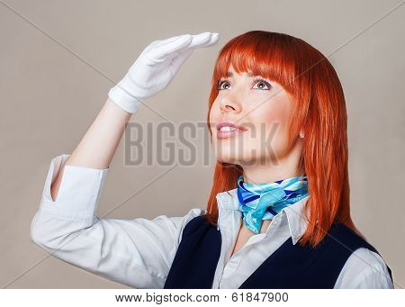Stewardess In Blue And White Uniform With Red Hair