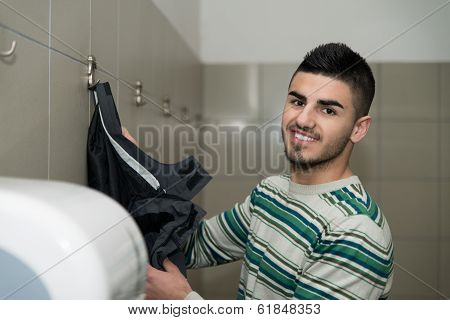 Portrait Of Young Man Prepairing To Take Ablution