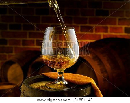 Glass of cognac tasting in the cellar