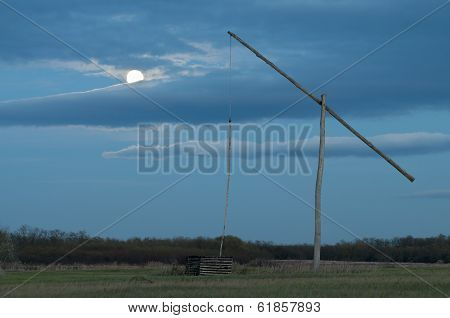Shadoof With Moon And Blue Sky