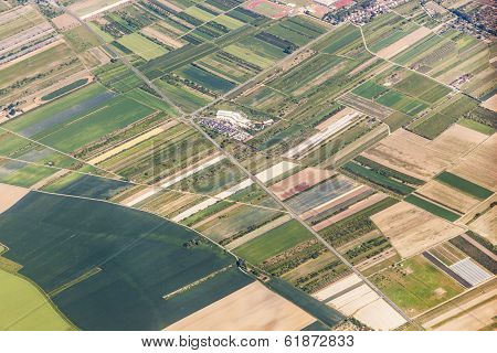 Aerial Of Small Village With Fields