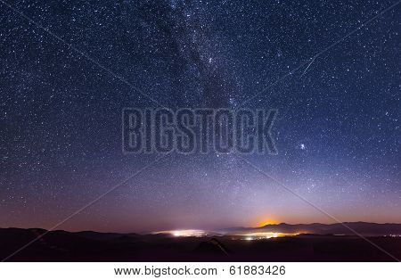 Lunar dawn over the ridge Chandalaz in Russia