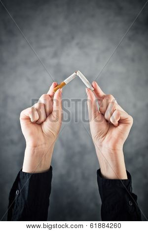 Woman Quits Smoking And Breaking Cigarette In Half