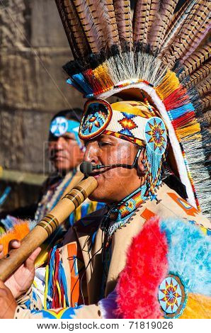 Native American Indian tribal group play music and sing on the street in historical city of York, UK