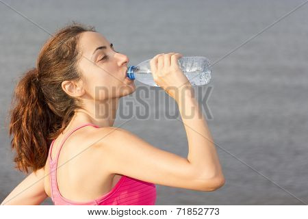 Athlete Woman Drinking Water Outdoors