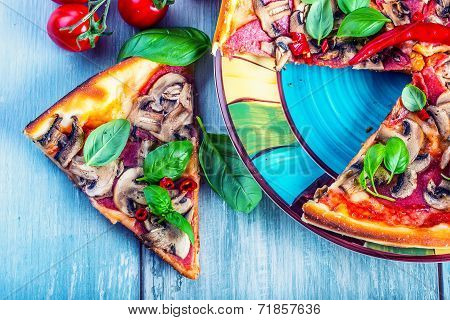 Italian salami pizza with mushrooms and pepperoni.