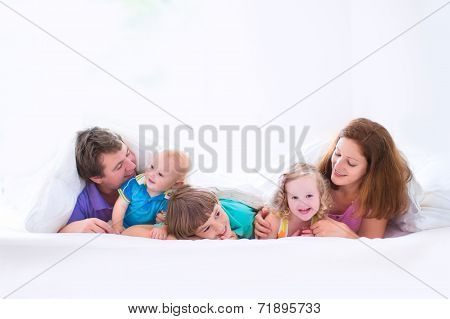 Happy Big Family In The Bedroom