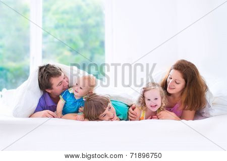 Happy Big Family In The Bedroom