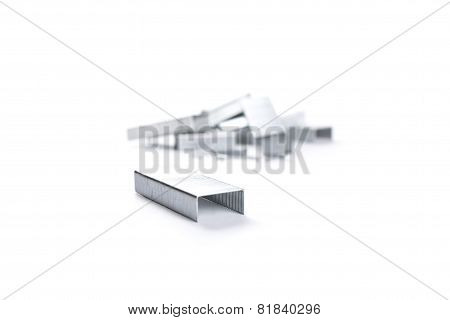 Stack Of Metal Staples. Isolated On A White.