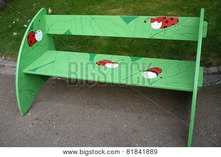Bench with ladybirds in park in Pilsen