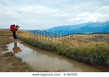 写真家、パドルと秋山
