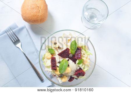 Seven-layer salad with egg tuna dried tomatoes and carrots