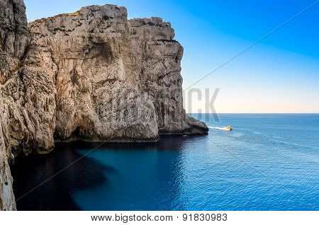Ocean Rocky Landscape With The Boat, Near Neptune's Cave, Sardinia