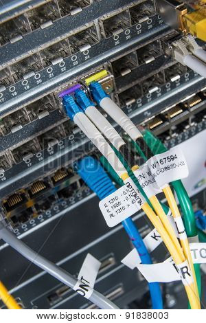 server with fiber optic  cables in data center