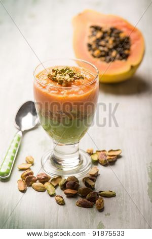mousse with papaia and pistachio nut,selective focus
