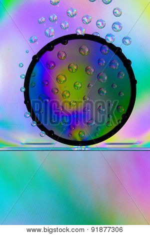 Amazing colors of white light that pass through the clear plastic, water drops and CPL filter.