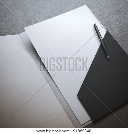 Black folder with pen