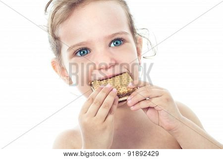 Beautiful Sweet  Little Girl Eating A Cookie