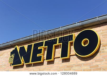 Aarhus, Denmark - May 1, 2016: Netto sign on a wall. Netto is a Danish discount supermarket operating in several European countries. Netto is owned by Dansk Supermarked Group
