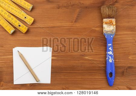 Paint brush on wooden background. Sales of paints and brushes. Housework. Supplies for painters.