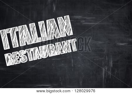 Chalkboard background with chalk letters: Delicious italian cuis