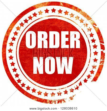 Order now sign, grunge red rubber stamp on a solid white backgro