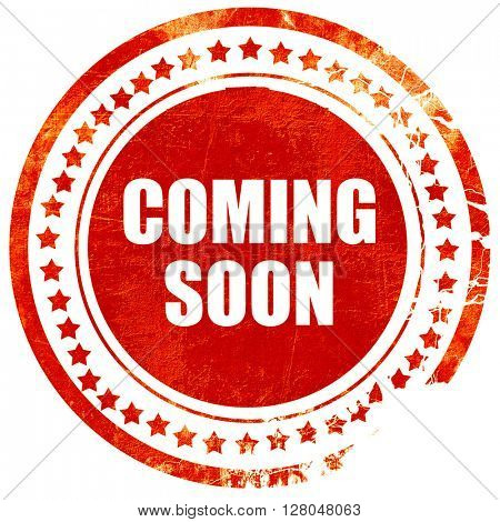 coming soon, grunge red rubber stamp on a solid white background