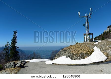 Alpine view from long road in spring time