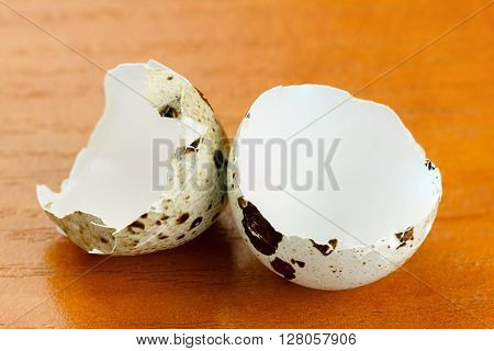 concept of failure broken mottled egg on a wooden surface