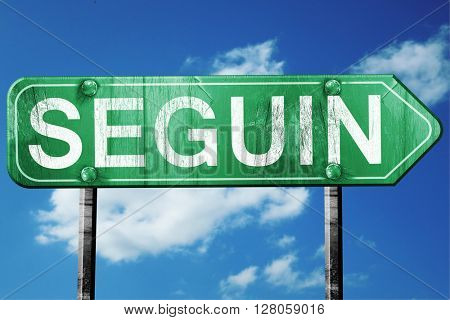 seguin road sign , worn and damaged look
