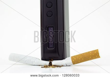 A box mod e-cigarette crushing a cigarette (close)