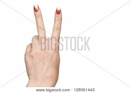 Gesture by two female finger up indicating victory or peace isolated on white background