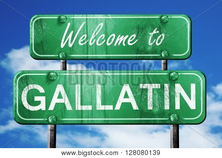 gallatin vintage green road sign with blue sky background
