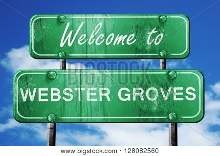 webster groves vintage green road sign with blue sky background