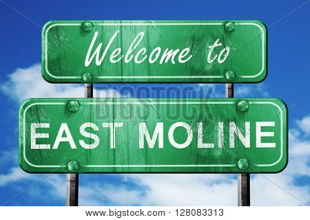 east moline vintage green road sign with blue sky background