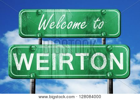 weirton vintage green road sign with blue sky background