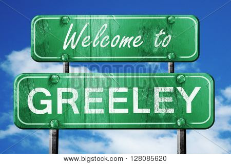 greeley vintage green road sign with blue sky background