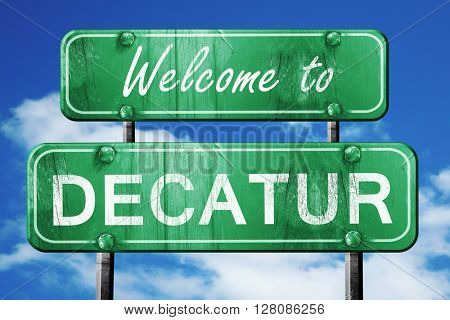 decatur vintage green road sign with blue sky background